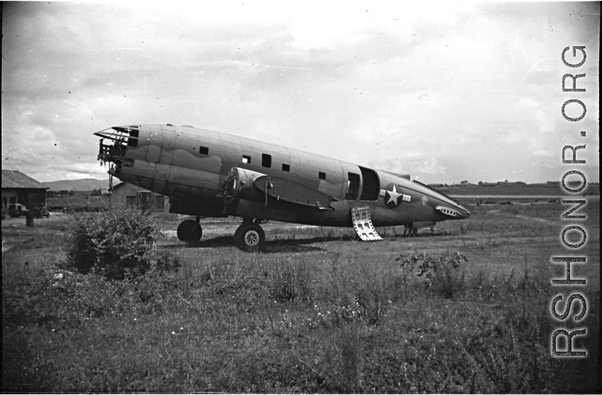 Fuselage of crashed American C-46 transport aircraft in the boneyard at the American airbase in Yunnan, China, during WWII--many of these were used as salvage for spare and repair parts for planes that were still flying.