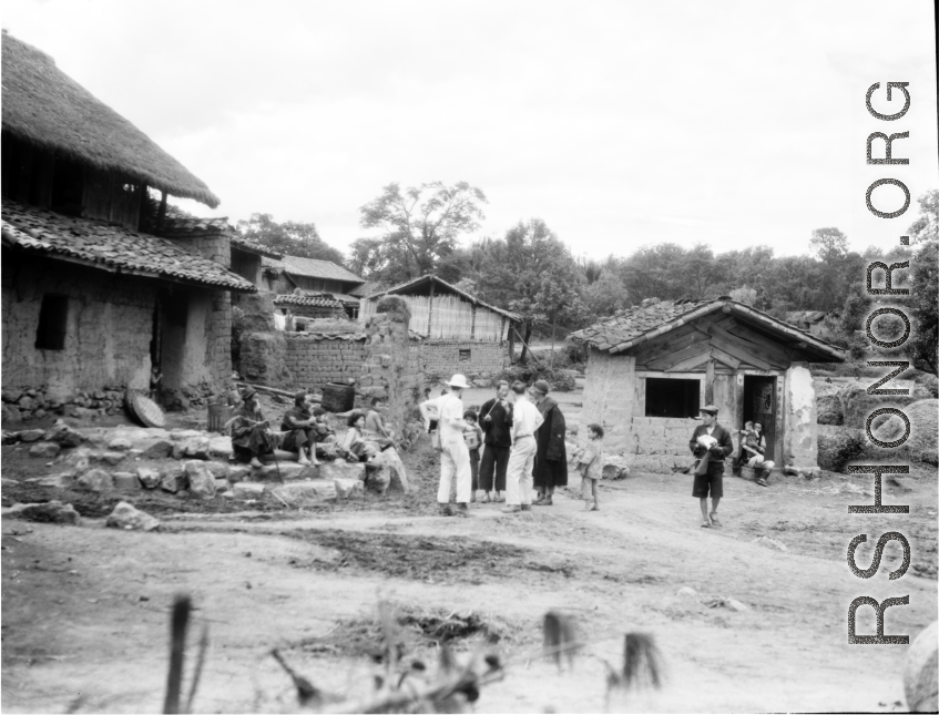An American photographer visits a village near Yangkai, Yunnan province, China, during WWII.