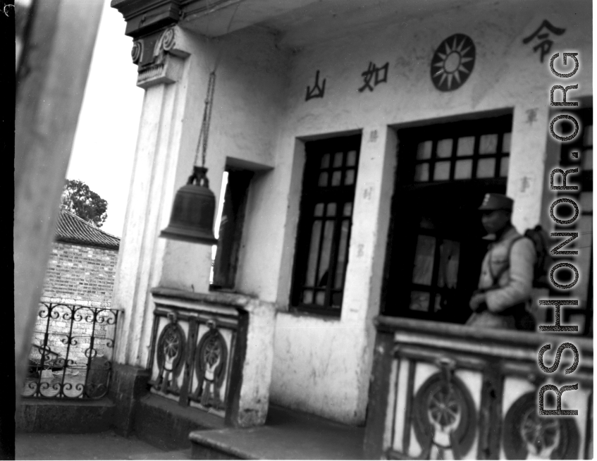 A Nationalist Chinese soldier at a Chinese military office in China during WWII.