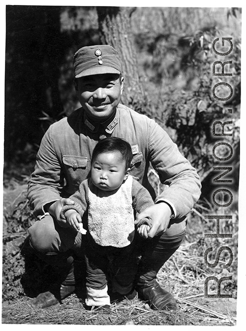 A Chinese Nationalist soldier, surname Li (李), and child in China during WWII. This was not a random family and Wozniak knew them, as another image in the collection show this image tacked to a wall in a home--a gift from Wozniak to the family.