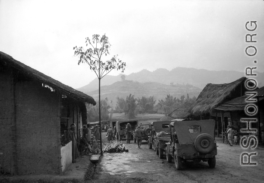 American military convoy goes through a small village in SW China. During WWII.