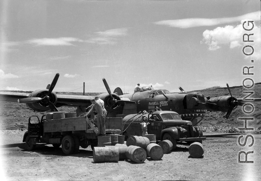 The B-24 "Maxwell House II" being refueled in a revetment in SW China, likely Sichuan, during WWII.
