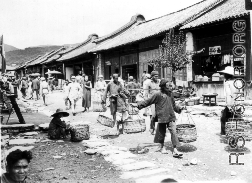 A bustling village street in SW China during WWII.