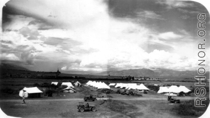 American tent camp on Burma Road in the Xiaguan/Dali area, with Erhai Lake in the background. During WWII.
