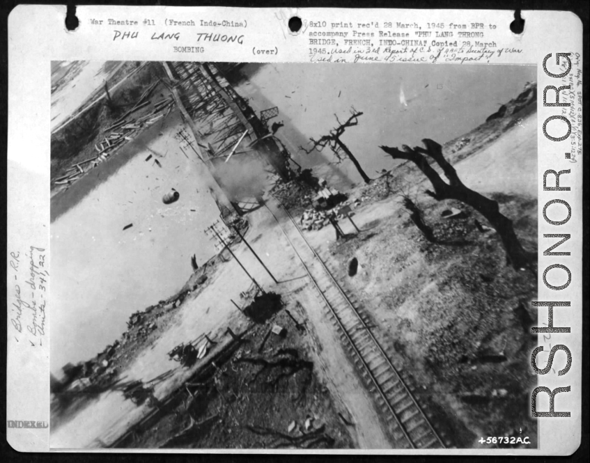 March 5, 1945 bombing on Phu Lang Thuong railway bridge over the Thuong River at Bắc Giang City in French Indochina (Vietnam), during WWII. In northern Vietnam, and along a critical rail route used by the Japanese. In this image there are bombs in the air, and the two water towers are completely gone.  "This was only one of the nine bridges destroyed by the Falcon group that day to bottle up Japanese supply and troop movements in anticipation of Japanese attempts to strike at French garrisons."  Coordinates