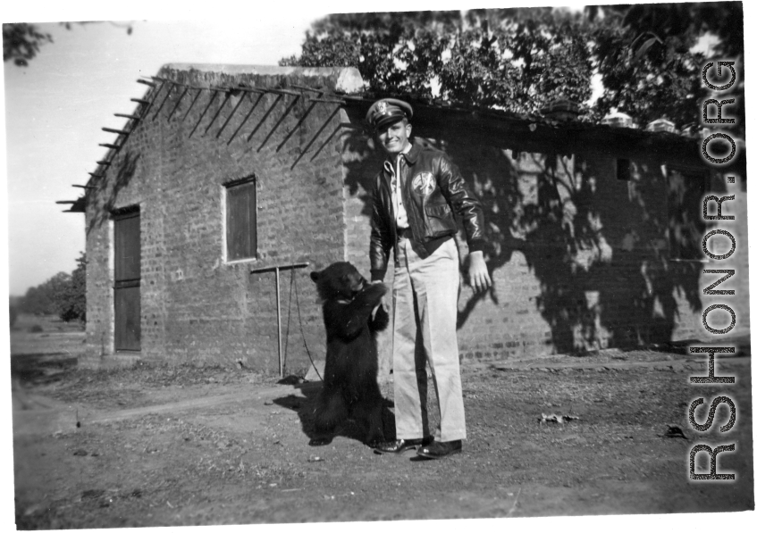 Flyer of Ringer Squadron with pet bear in the CBI during WWII.