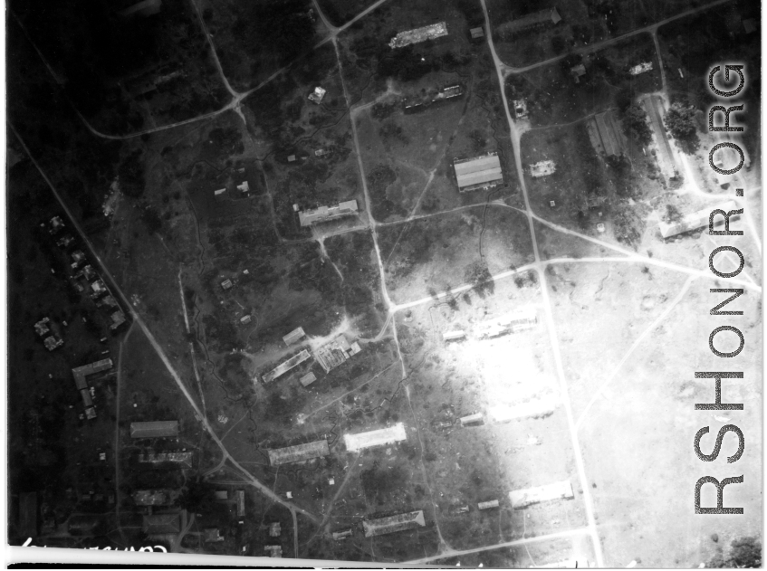 Bombing of small town with extensive bomb trenches in a region of savanna, either in Burma or French Indochina. During WWII.