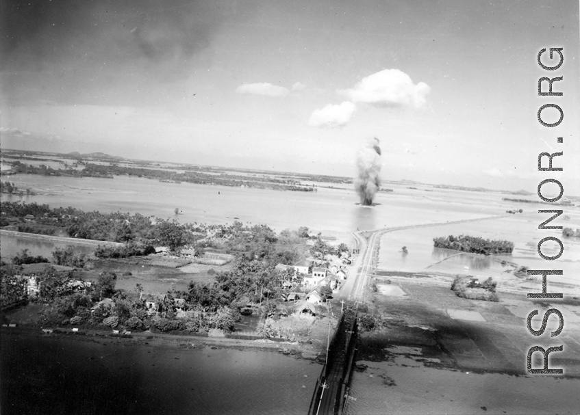 Large and inexplicable explosion near the Ninh-Bình railway bridge in French Indochina (Vietnam), during WWII. Ninh Bình is a small city in the Red River Delta of northern Vietnam, and along a critical rail route used by the Japanese.  Coordinates: 20°15'39.7"N 105°59'06.3"E
