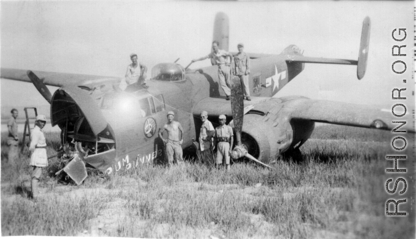 Johnson, Macaluso, Wild Bill Gornick, Lemmon pose with a crashed "Rum Runner" B-25 in Liuzhou June 1944.  William "Wild Bill" Gornick completed his required 200 combat flying hours on "Rum Runner" as it crash landed  following  a  mission against Tien Ho airbase.  Bill assisted the maintenance personnel with salvaging all the useable parts they could until he left for the USA a few days later.