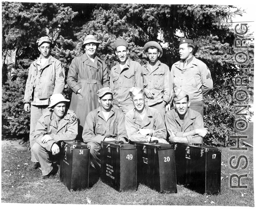 A group of trainees in photography during WWII, with boxes for "Type-C-I" ground cameras.  Edward H. Dixon is standing in back row, far left.