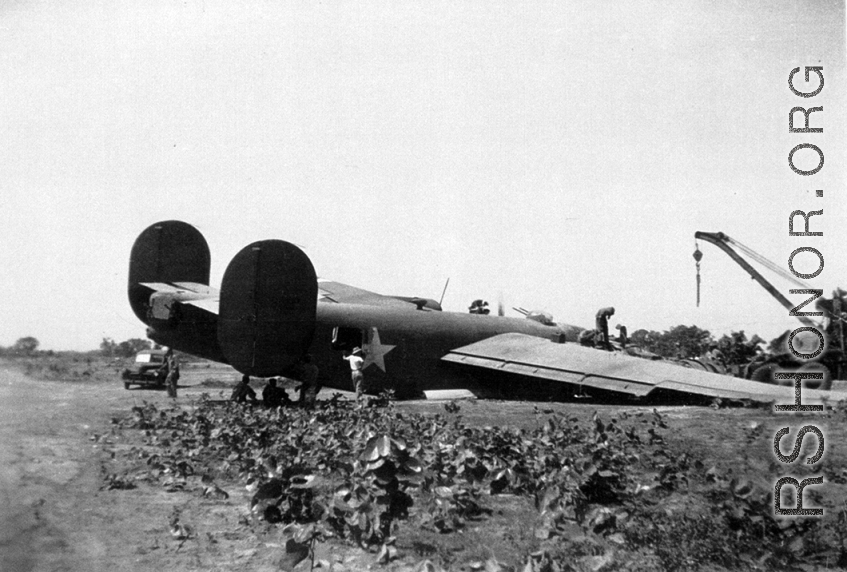 Salvage of a broken B-24 "WE'REWOLVES", crashed on take-off crash on March 20th, at Panagarh. Upon crash, live bombs were spewed out of the bomb bay. Fortunately the arming pins were still in the fuses. Speculation of some was that the accident was caused by loss of lift due to the negative angle of attack caused by a high speed take-off.
