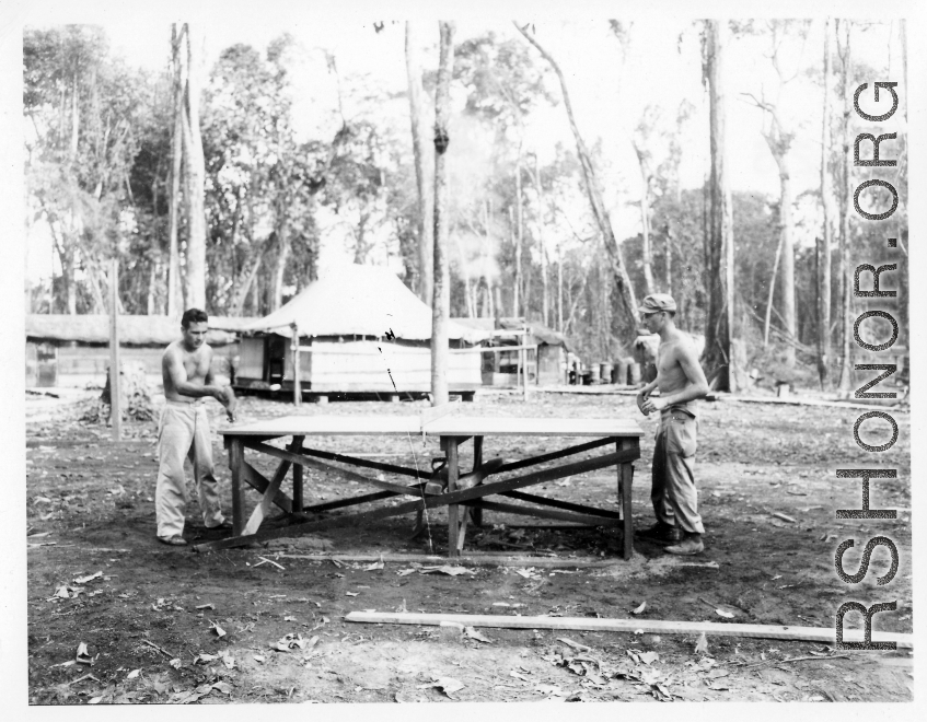 GIs of the 797th Engineer Forestry Company in Burma, playing ping pong in camp.  During WWII.