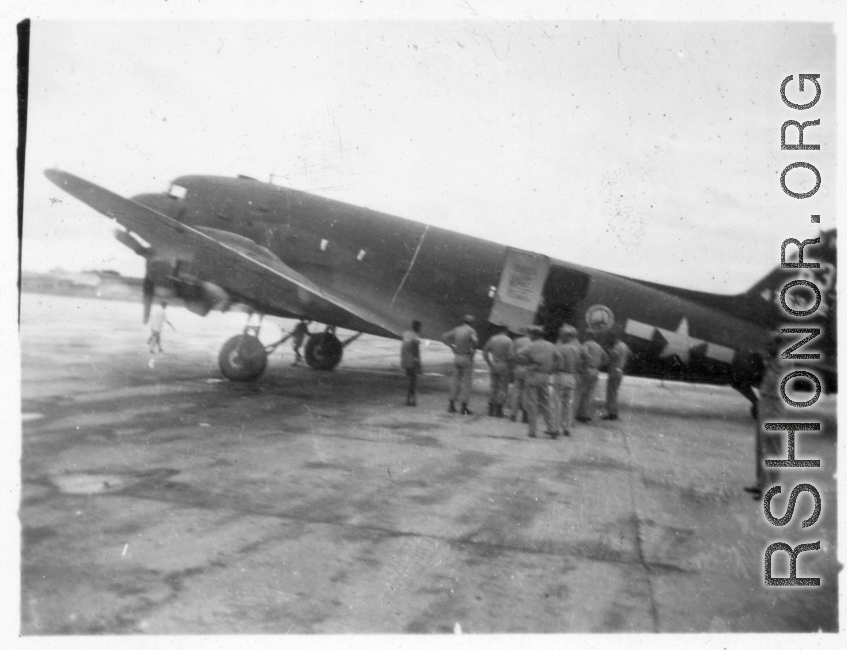 A C-47 transport of the ATC, tail #476342, on pavement at an airbase in in Burma during WWII.