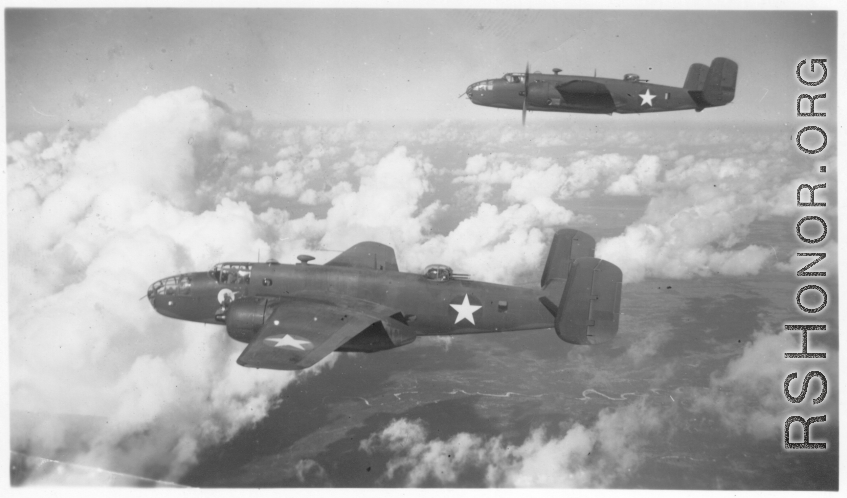 B-25s of the 22nd Bombardment Squadron in flight over wet plains in SW China or Burma during WWII.