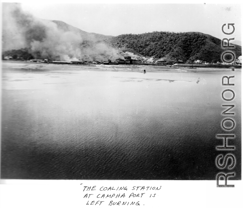 The coaling station at Campha Port, French Indochina, is left burning after bombing raid by B-25s.  22nd Bombardment Squadron.