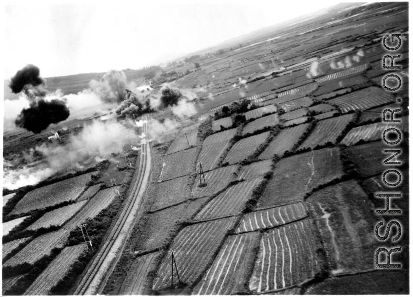 Low altitude bombing of railway near Van Trai Railroad Station, likely French Indochina. 