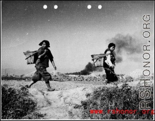 Chinese women flee Japanese air raid on Kunming during WWII.