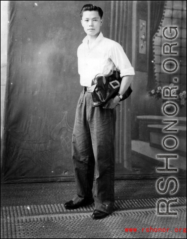 A  young Chinese man poses for photographer during WWII.