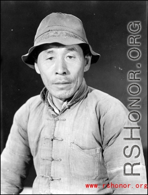 Chinese man in China poses for the photographer. During WWII.