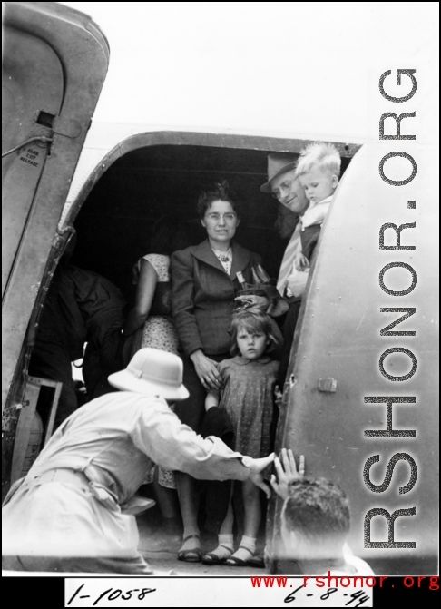 A civilian family of westerners on a military C-47 transport in the CBI during WWII, on June 8, 1944.