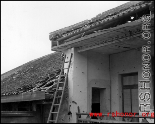 Bomb damage to a building at an American base in China during WWII.