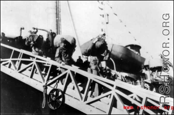 GIs line up to disembark ship on the way back to the US after the war. The ship is probably the SS Marine Raven.