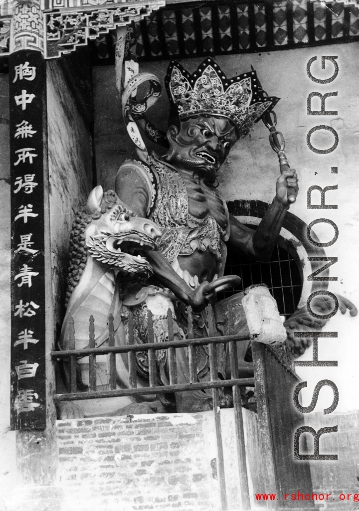 Door guards at a Buddhist temple in China, during WWII.