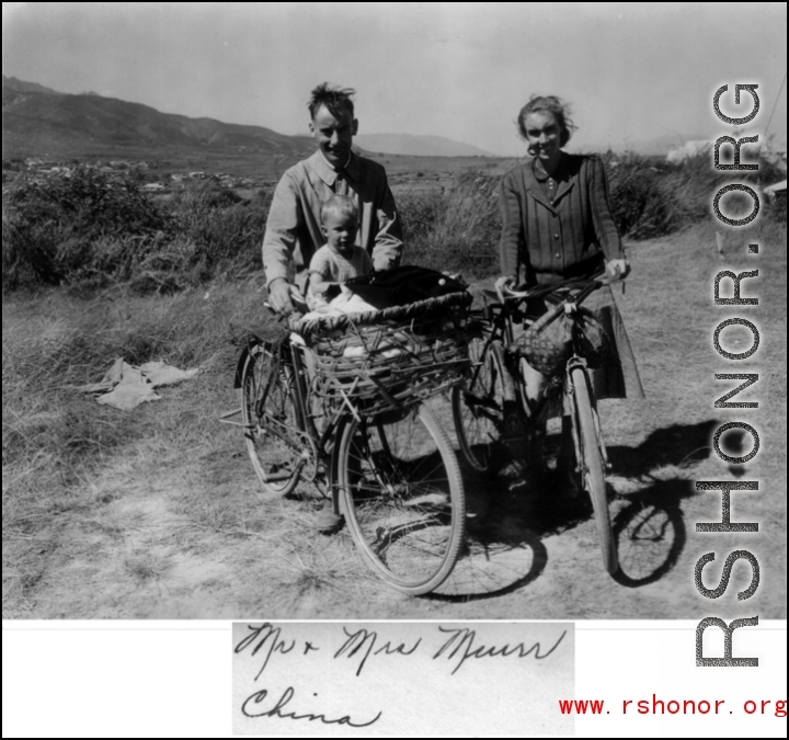 A western couple, "Mr. & Mrs. Muir" with child on bicycles in the Xiaguan/Dali area, near the outlet to Erhai Lake. During WWII.  This is the missionary couple Frank and Gladys Muir, and one of their two sons.
