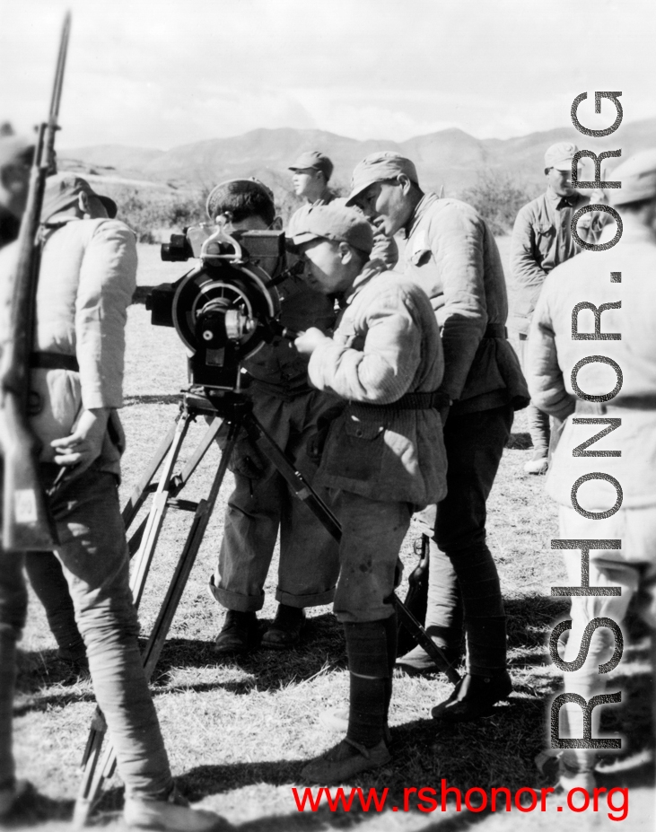 Chinese troops look at movie camera.