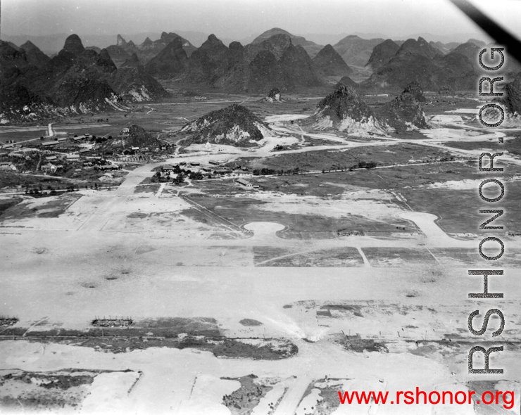 Aerial view of one of the runways at Guilin, Guangxi, China, during WWII.  Notice bomb or demolition holes in runway.  Image from U. S. Government official sources.