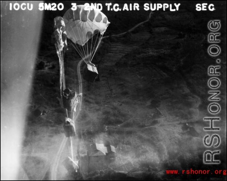 A US cargo plane drops supplies from the air. 10CU 5M20 3 2ND T.C. AIR SUPPLY SEC.