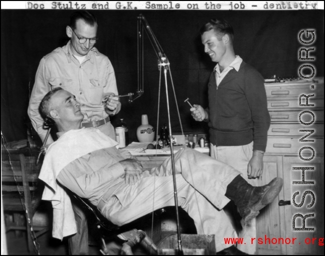 Medical care somewhere in the CBI.  Doc Stultz and G. K. Sample on the job--dentistry.