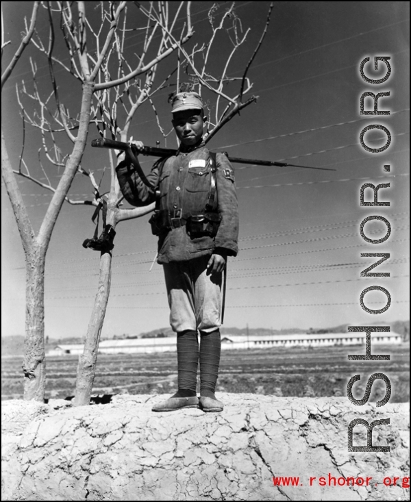 A Chinese soldier keeping guard at an American base, somewhere in China.