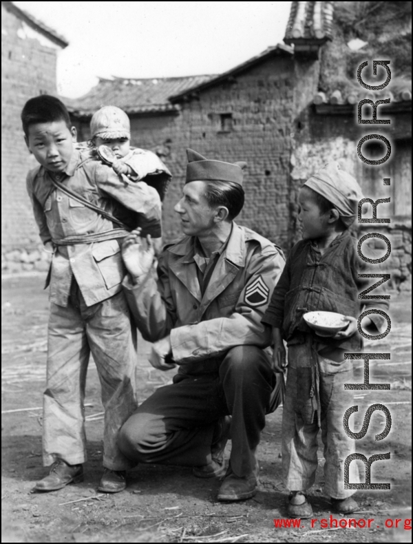 Ted Karczewski (??) with Chinese children somewhere in China.