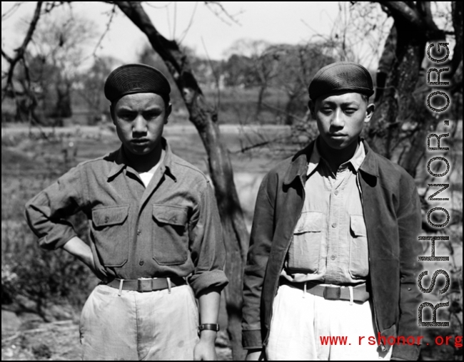 Two young Chinese men in China, most likely on an American base where they work as staff. During WWII.