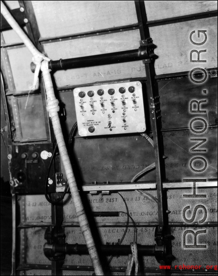 An indicator panel next to the door of a C-46 or C-47 transport's cargo door, used to coordinate air dropping of supplies.