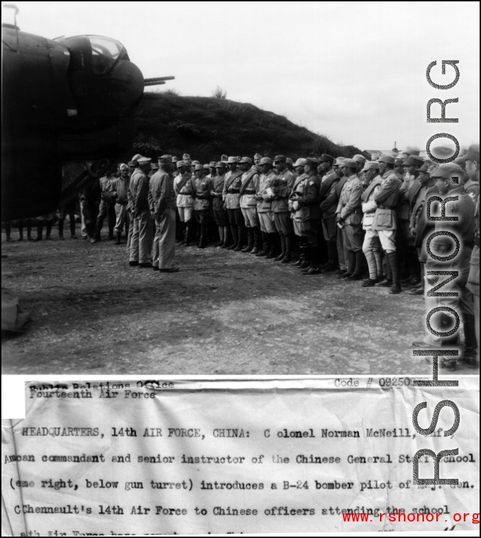 Colonel Norman McNeill, Inf., American commandant and senior instructor of the Chinese General Staff School introduces a B-24 bomber pilot of Maj. Gen. Claire Chennaults 14th Air Force to Chinese officers attending the school at a 14th Air Force base...