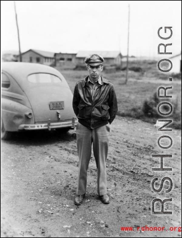 An American serviceman in the CBI with a sedan car.  From the collection of Wozniak, combat photographer for the 491st Bomb Squadron, in the CBI.