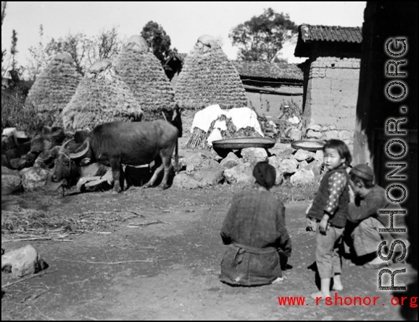 People in a small village in China, probably in Yunnan province.