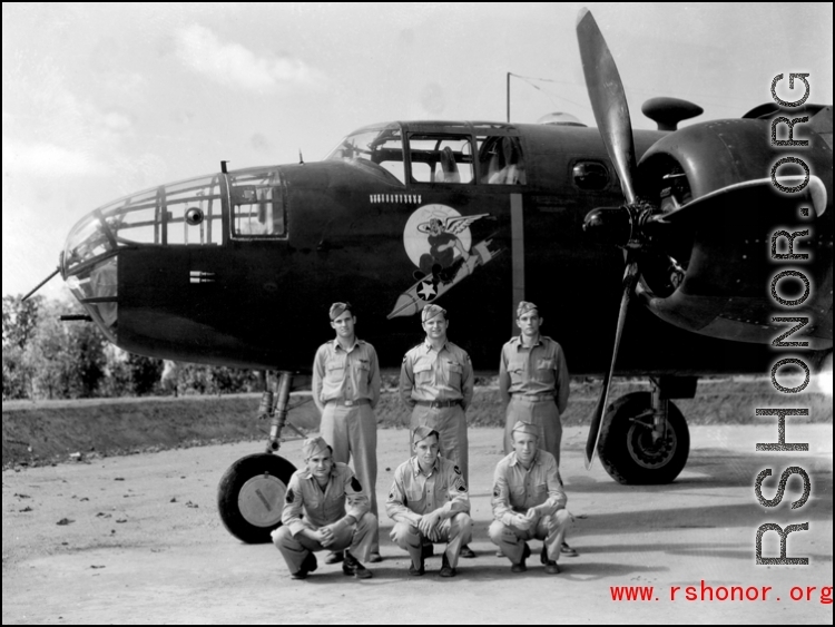 Unidentified members, probably an aircrew, beside a B-25C of the 491st Bombardment Squadron at Chakulia, India, sometime in 1943.