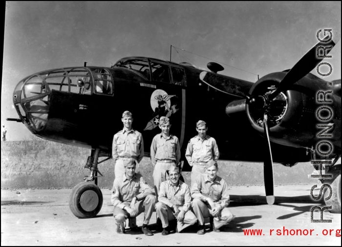 Unidentified aircrew members of the 491st Bombardment Squadron at Chakulia AB, India. The Squadron's early emblem (1942-43) representing "The Bomb Jockeys" shows clearly on the side of the B-25C. The insigne was not officially accepted. Late in 1943, their "Ringers Squadron" moto and emblem were accepted.  (Information courtesy of Tony Strotman)