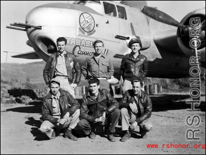 At Yangkai, China, posing with the B-25H "Wabash Cannonball", are air crewmen of the 491st Bomb Squadron. In front are T/Sgt Michael F. Hassay (flight engineer), T/Sgt John F. Daley (radio), and S/Sgt Kurt E. Hemrick (gunner). Behind them stand Lt. Frank S. Burgess (pilot), Lt. Farlie A. Garner (copilot), and Lt Gordon P. Edwards (bombardier).