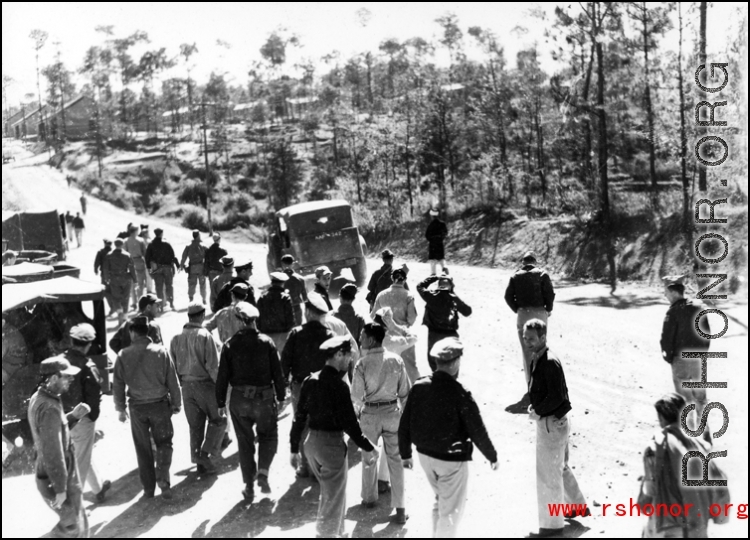 American GIs at Yangkai base in Yunnan province in the CBI walk on the road. During WWII.