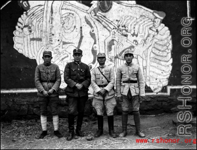 Chinese soldiers in the CBI standing before mural. During WWII.