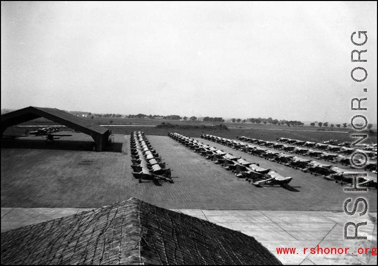 L-5s lined up in rows in India.  From the collection of David Firman, 61st Air Service Group.
