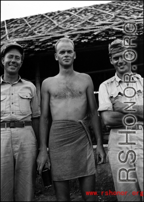 Three GIs pose for the camera--including one in a bath towel--in the CBI during WWII.    From the collection of David Firman, 61st Air Service Group.