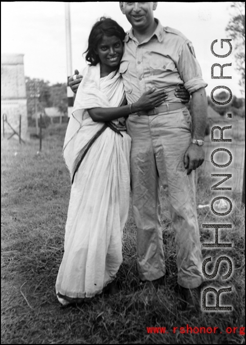 A woman in India hugs a GI during WWII.  From the collection of David Firman, 61st Air Service Group.