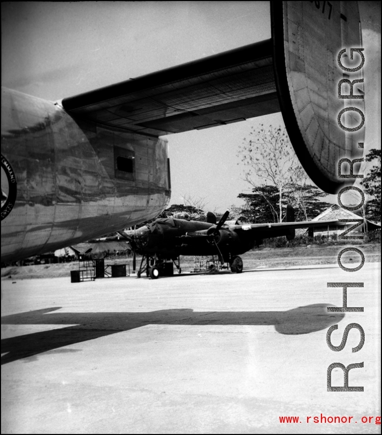 A B-25 as seen from under the wing of an Air Transport Command (ATC) C-109 transport plane based on the B-24 air frame.  From the collection of David Firman, 61st Air Service Group.