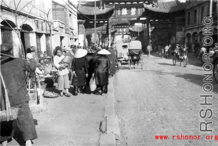 The Golden Horse 金马 archway in Kunming, and the other of the pair, the Emerald Rooster Archway (金马碧鸡坊), in the distance.  In the CBI during WWII.