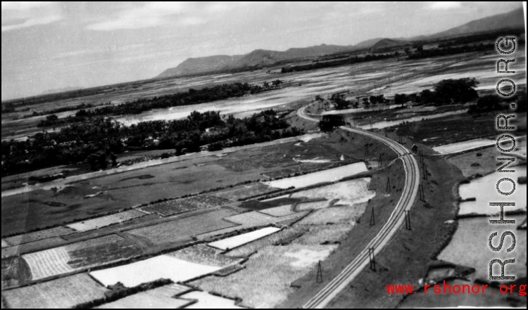 An aerial photograph taken from an American war plane over a Japanese-held railway in SW China or Indo-China during WWII in the CBI.